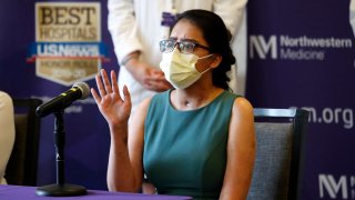 Mayra Ramirez, a COVID-19 survivor due to a double-lung transplant, responds Thursday, July 30, 2020, to a question about her journey through the pandemic during her first news conference at Northwestern Memorial Hospital in Chicago. Ramirez is the first known patient in the United States who received double-lung transplants due to COVID-19.