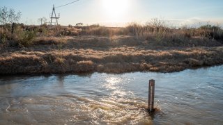 A depth gauge is seen in the Rio Grande