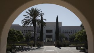 Manchester Hall is seen through an arch on the campus of San Diego State University (SDSU), part of the California State University (CSU) system, in San Diego, California, U.S., on Thursday, July 9, 2020. The U.S. economy is caught in the middle of President Trump’s tug-of-war to reopen schools — and could end up damned no matter what happens. Photographer: Bing Guan/Bloomberg via Getty Images