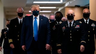 In this July 11, 2020, file photo, President Donald Trump wears a mask as he visits Walter Reed National Military Medical Center in Bethesda, Maryland.