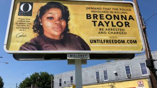 A billboard sponsored by O, The Oprah Magazine, is on display with a photo of Breonna Taylor