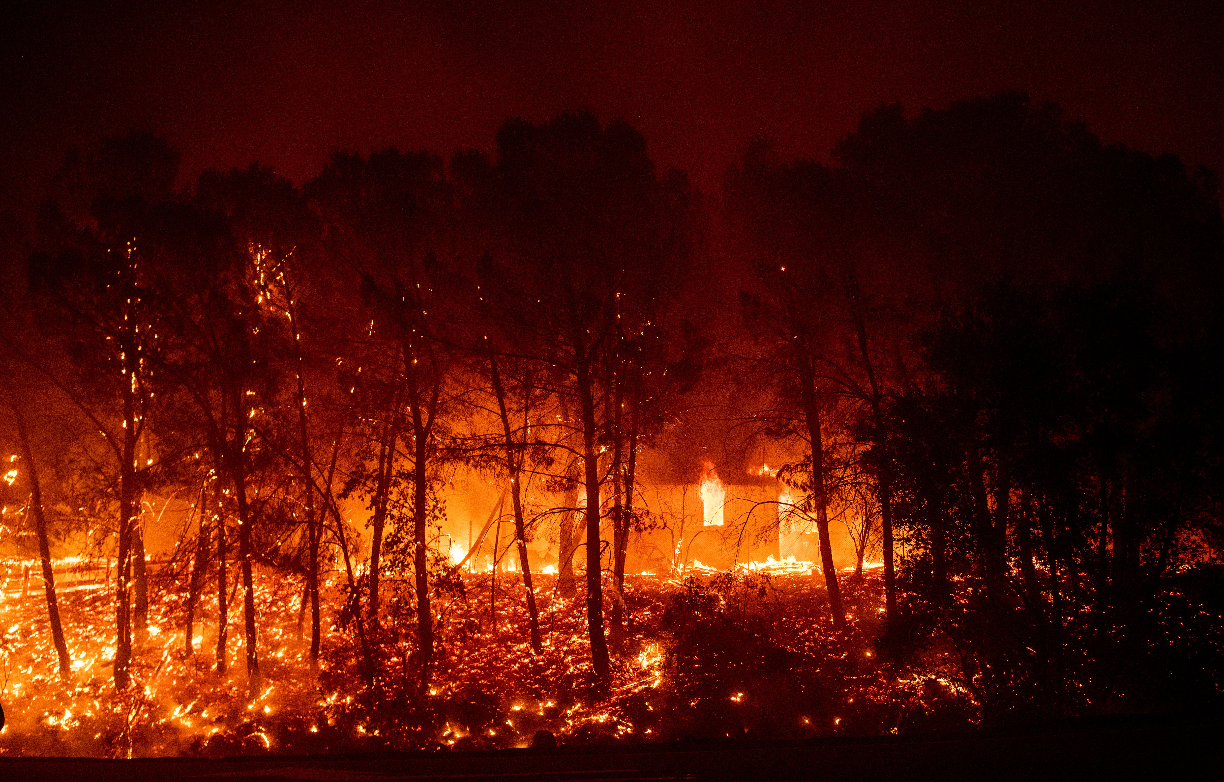 A home burns in the valley area of Vacaville, northern California during the LNU Lightning Complex fire on August 19, 2020. – As of the late hours of August 18, the Hennessey fire has merged with at least 7 fires and is now called the LNU Lightning Complex fires. Dozens of fires are burning out of control throughout Northern California as fire resources are spread thin. (Photo by JOSH EDELSON / AFP) (Photo by JOSH EDELSON/AFP via Getty Images)