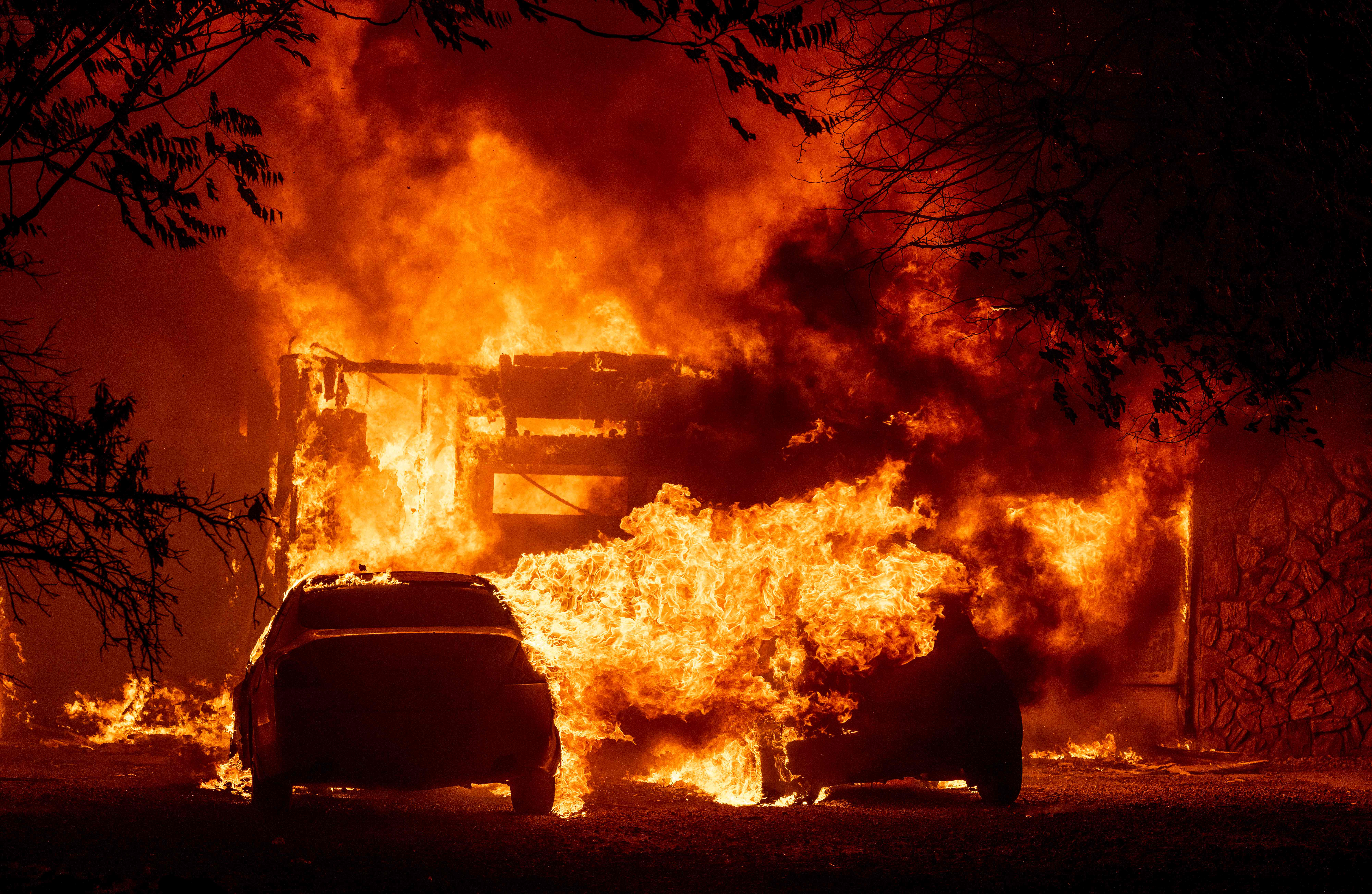 A home burns in Vacaville, California during the LNU Lightning Complex fire on August 19, 2020. – As of the late hours of August 18,2020 the Hennessey fire has merged with at least 7 fires and is now called the LNU Lightning Complex fires. Dozens of fires are burning out of control throughout Northern California as fire resources are spread thin. (Photo by JOSH EDELSON / AFP) (Photo by JOSH EDELSON/AFP via Getty Images)