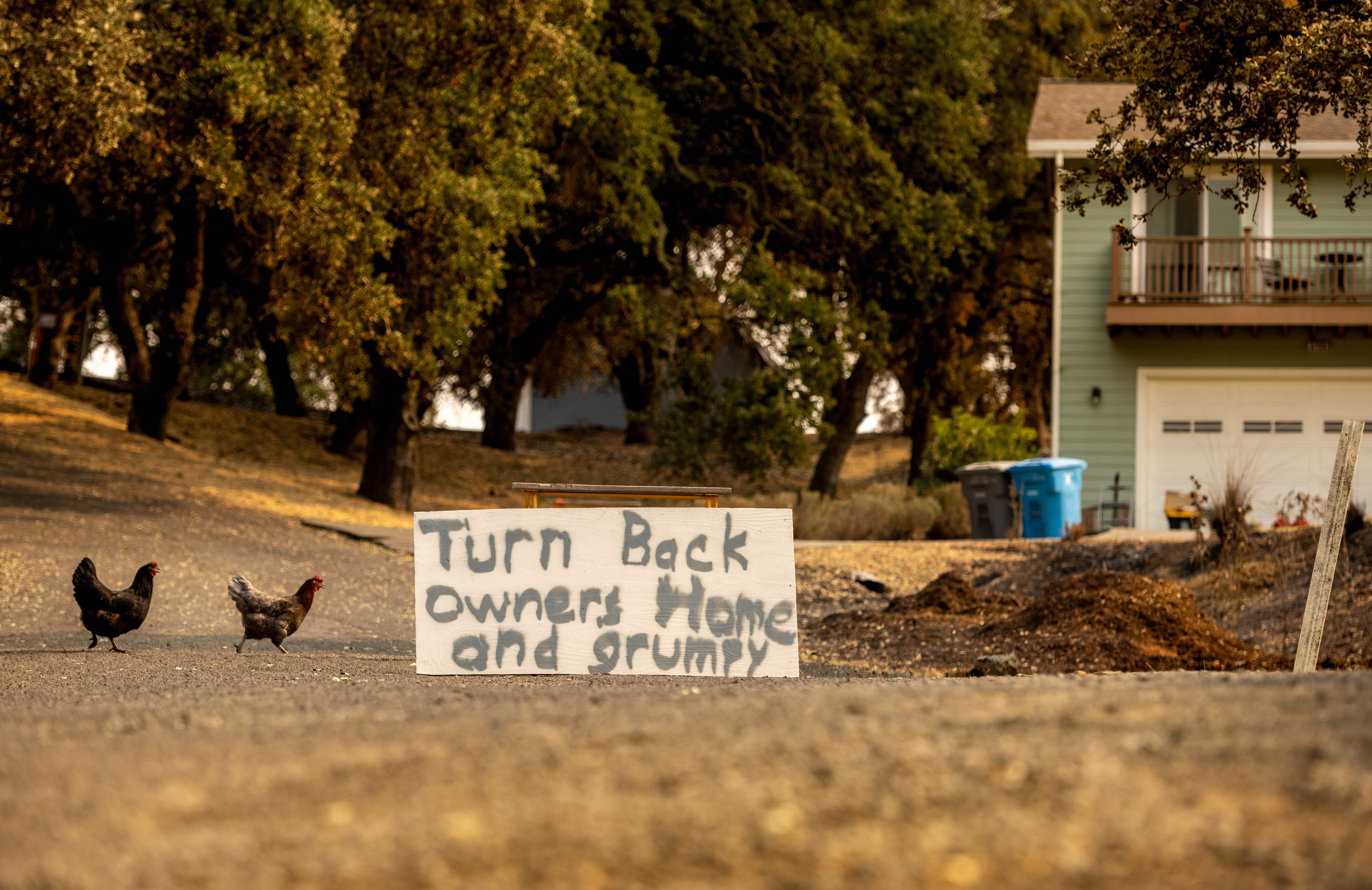 A burned car and home are seen next door to an untouched home in during the LNU Lightning Complex fire in Bucktown, California on August 24, 2020. – Thousands of firefighters made small progress on August 24 as they battled to contain historic wildfires in California, with potentially dangerous lighting storms proving milder than expected and temperatures easing.<br />
Governor Gavin Newsom said some 625 fires were burning throughout the state and had scorched more than 1.2 million acres — nearly the size of the Grand Canyon. (Photo by JOSH EDELSON / AFP) (Photo by JOSH EDELSON/AFP via Getty Images)