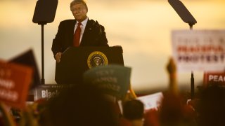 U.S. President Donald Trump speaks during a campaign rally at the Pro Star Aviation hangar in Londonderry, New Hampshire, U.S., on Friday, Aug. 28, 2020. Trump took aim at people protesting racism and police brutality, saying they are just looking for trouble and dont know about the killing of a Black man at the hands of police in Minneapolis that led to demonstrations nationally.