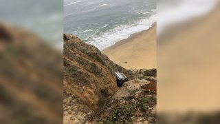 A photo taken by firefighters at the scene of a vehicle crash over the cliff off of Highway 1 near Gray Whale Cove south of Devil's Slide in San Mateo County, California on Aug. 31, 2020.