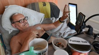 Alain Cocq, suffering from a rare blood disease, rests on his medical bed on August 12, 2020 in his flat in Dijon, northeastern France
