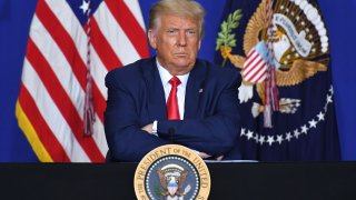 US President Donald Trump listens to officials during a roundtable discussion on community safety, at Mary D. Bradford High School in in Kenosha, Wisconsin on September 1, 2020. - Trump said Tuesday on a visit to protest-hit Kenosha, Wisconsin that recent anti-police demonstrations in the city were acts of "domestic terror" committed by violent mobs.