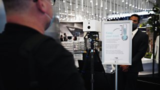 A visitors temperature is taken with an Iris Thermal Scanning device at the entrance to Edge observation deck at Hudson Yards as the city continues Phase 4 of re-opening following restrictions imposed to slow the spread of coronavirus on September 4, 2020 in New York City.