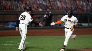 SAN FRANCISCO, CALIFORNIA – SEPTEMBER 16: Evan Longoria #10 of the San Francisco Giants is congratulated by third base coach Ron Wotus after he hit a home run in the third inning against the Seattle Mariners at Oracle Park on September 16, 2020 in San Francisco, California. (Photo by Ezra Shaw/Getty Images)
