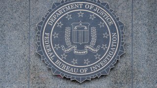 Close-up of the seal of the Federal Bureau of Investigation (FBI) of the wall of J Edgar Hoover FBI Building, Washington DC, January 21, 2017.