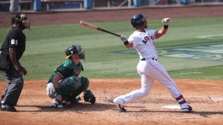 Michael Brantley of the Houston Astros hits a home run in the fifth inning during Game 4 of the ALDS between the Houston Astros and the Oakland Athletics.