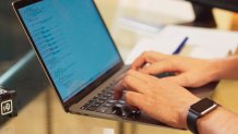 Hands on a computer keyboard