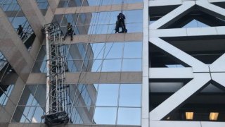 Two window washers left dangling on ropes after their scaffolding collapsed in Walnut Creek.