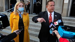 Mark McCloskey addresses the press alongside his wife Patricia, Oct. 6, 2020, outside the Carnahan Courthouse in St. Louis, Mo.