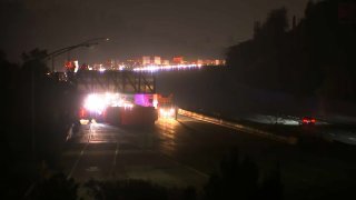 An overturned box truck blocks lanes of Highway 101 in San Jose. (Oct. 8, 2020)