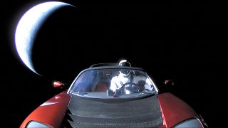 In this handout photo provided by SpaceX, a Tesla roadster launched from the Falcon Heavy rocket with a dummy driver named “Starman” heads towards Mars. (Photo by SpaceX via Getty Images)