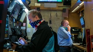 Traders work the floor of the New York Stock Exchange.