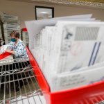 Lehigh County workers count ballots as vote counting in the general election continues, Thursday, Nov. 5, 2020, in Allentown, Pennsylvania. Joe Biden took the lead in Pennsylvania early Friday morning.