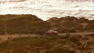 Crews work at the scene of a cliff rescue in San Francisco.