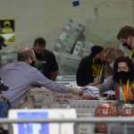 Allegheny County election employees organize ballots at the Allegheny County elections warehouse on November 7, 2020 in Pittsburgh, Pennsylvania. Biden edged Trump by over 34,000 votes on Saturday, giving Biden the 20 electoral college votes for the closely contested state.