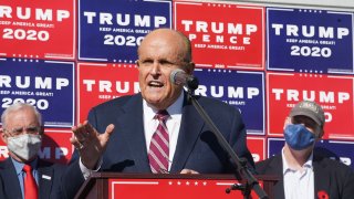 FILE - Attorney for the President, Rudy Giuliani, speaks at a news conference in the parking lot of a landscaping company on Nov. 7, 2020 in Philadelphia.