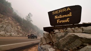 In this Sept. 11, 2020, file photo, a vehicle enters the Sierra National Forest northeast of Fresno in the foothills of the Sierra Nevada mountains during the Creek fire in Auberry, Fresno County.