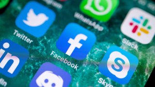 The Facebook app is displayed on the screen of an iPhone.
