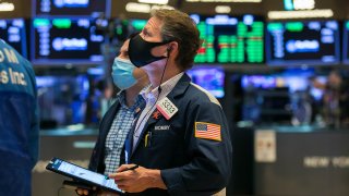 Traders work on the floor of the New York Stock Exchange.
