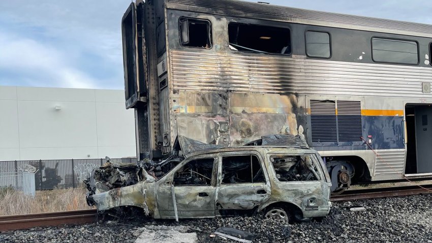 Damage following a train vs. car collision in Newark.
