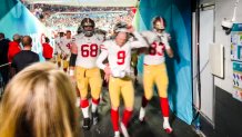 49ers players leave the field dejected