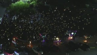 A crowd of carolers outside a Thousand Oaks mall.