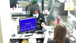 Surveillance cameras capture a man suspected of robbing a Bank of America branch Monday in Santa Rosa. (Dec. 29, 2020)