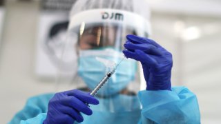 Healthcare workers prepare Pfizer coronavirus disease (COVID-19) vaccinations