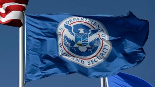 FILE - The U.S. Department of Homeland Security flag, July 31, 2014, in Karnes City, Texas.