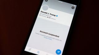 The suspended Twitter Inc. account of U.S. President Donald Trump on a smartphone arranged in Washington, D.C., U.S., on Saturday, Jan. 9, 2021.