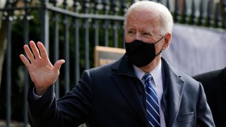 President Joe Biden waves as he departs after attending Mass at Holy Trinity Catholic Church, Sunday, Jan. 24, 2021, in the Georgetown neighborhood of Washington. Biden plans to sign an executive order Monday, Jan. 25 that aims to boost government purchases from U.S. manufacturers.