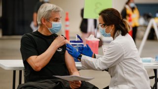 A person receives the COVID-19 vaccine.