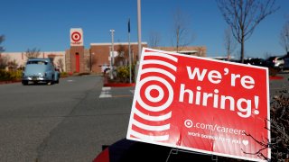 In this Feb. 5, 2021, file photo, a hiring sign is posted in front of a Target store in San Rafael, California.