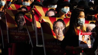 In this Feb. 20, 2021, file photo, anti-coup protesters hold placards as they protest against the military coup in Yangon, Myanmar.
