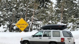 Skiers leave the parking lot at Alpine Meadows ski resort in Alpine Meadows, California, Friday, Jan. 17, 2020.