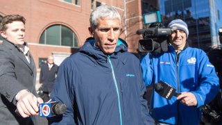 William "Rick" Singer leaves Boston Federal Court after being charged with racketeering conspiracy, money laundering conspiracy, conspiracy to defraud the United States, and obstruction of justice on March 12, 2019, in Boston.