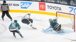 St. Louis Blues Right Wing Mackenzie MacEachern scores past San Jose Sharks Goalie Devan Dubnyk.
