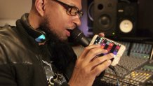 Bosko Kante plays his invention, the ElectroSpit talkbox, in the company's West Oakland headquarters.