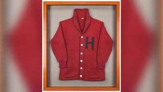 This undated photo released by RR Auction shows a Harvard University letter sweater that once belonged to former President John F. Kennedy, up for auction between Feb. 11-18, 2021, by the Boston-based auction firm.