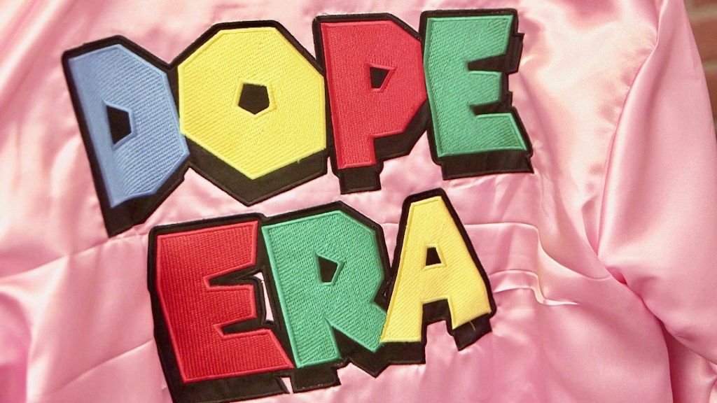 A logo for Dope Era on the back of a jacket in Mistah F.A.B.'s Oakland store.