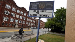 A sign in front of King Elementary School encourages students to participate in remote learning on September 08, 2020 in Chicago, Illinois.