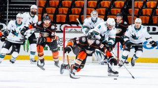 ANAHEIM, CA – MARCH 12: Max Jones #49 of the Anaheim Ducks and Evander Kane #9 of the San Jose Sharks battle for the puck during the first period of the game at Honda Center on March 12, 2021 in Anaheim, California. (Photo by Debora Robinson/NHLI via Getty Images)