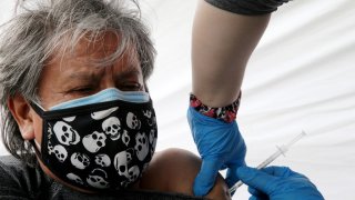 Gregorio Noriega, originally from Mexico, receives a one-shot dose of the Johnson & Johnson COVID-19 vaccine at a clinic targeting immigrant community members on March 25, 2021 in Los Angeles, California. The clinic, run by the St. John’s Well Child and Family Center, estimates it has vaccinated more than 100,000 people in the Los Angeles area amid reports of two undocumented women who were refused coronavirus vaccinations in Orange County Rite Aid stores. Rite Aid has called the refusals mistakes, according to a written statement by the company.