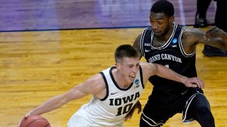 Iowa's Joe Wieskamp (10) drives to the basket between Grand Canyon's Jovan Blacksher Jr. (10) and Oscar Frayer during the first half of a first round NCAA college basketball tournament game Saturday, March 20, 2021, at the Indiana Farmers Coliseum in Indianapolis.